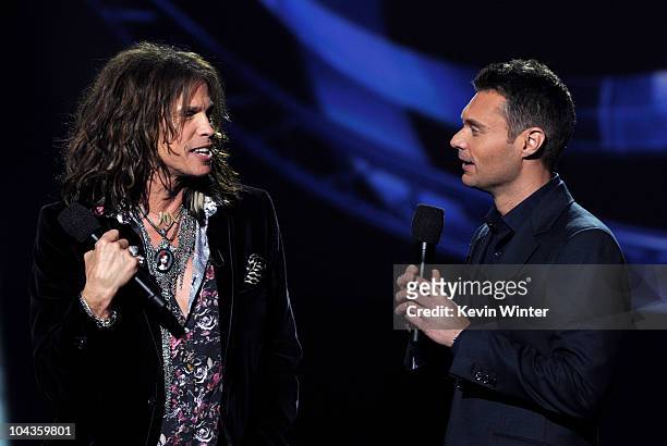 Singer Steven Tyler and host Ryan Seacrest appear onstage at a press conference to officially announce the season 10 "American Idol" judges panel at...