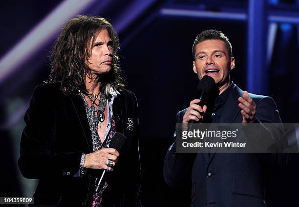 Singer Steven Tyler and host Ryan Seacrest appear onstage at a press conference to officially announce the season 10 "American Idol" judges panel at...