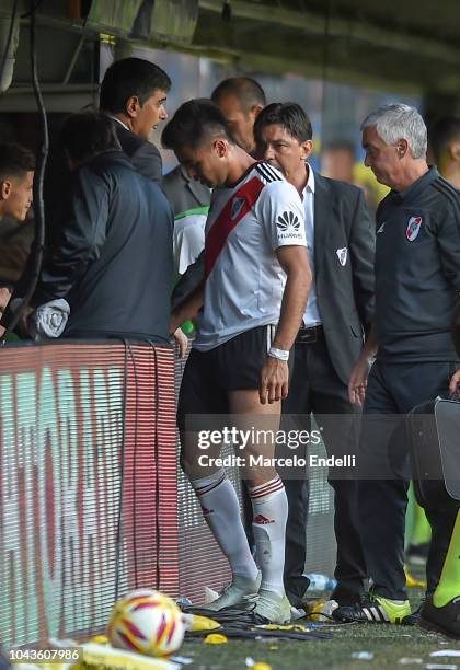 Gonzalo Martinez of River Plate leaves the field injured during a match between Boca Juniors and River Plate as part of Superliga 2018/19 at Estadio...