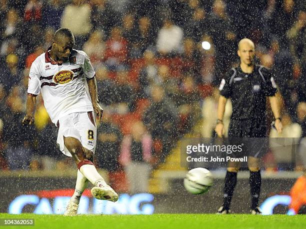 Abdul Osman of Northampton Town scores the winning penalty during the Carling Cup 3rd round game between Liverpool and Northampton Town at Anfield on...