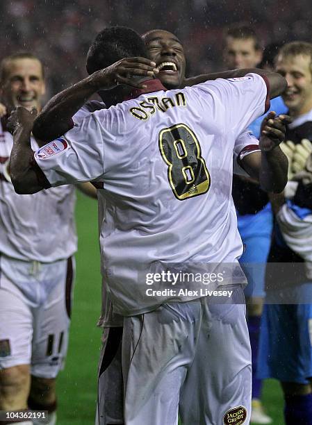 Nathaniel Wedderburn of Northampton Town celebrates with team mate Abdul Osman after winning a penalty shootout during the Carling Cup Third Round...