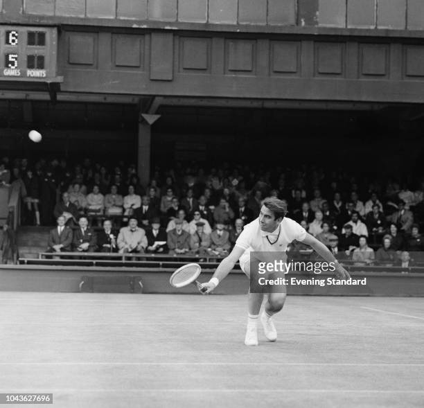 Spanish tennis player Manuel Santana in action at Wimbledon Championships, All England Lawn Tennis and Croquet Club, London, UK, 1st July 1968.