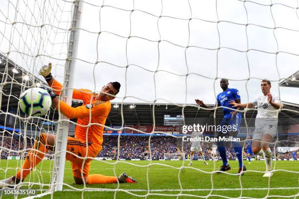 Johann Gudmundsson of Burnley scores his team's first goal past Neil Etheridge of Cardiff City during the Premier League match between Cardiff City...