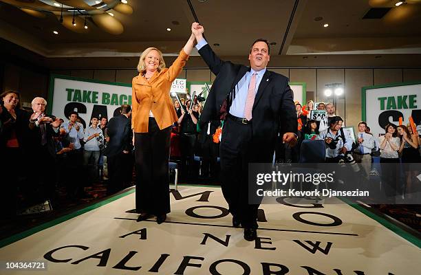 Gov. Chris Christie of New Jersey holds the hand of California Republican Party gubernatorial candidate Meg Whitman during a campaign event on...