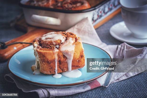 preparing cinnamon buns in domestic kitchen - rolled up stock pictures, royalty-free photos & images