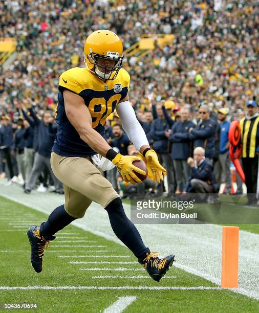 Jimmy Graham of the Green Bay Packers scores a touchdown during the first quarter of a game against the Buffalo Bills at Lambeau Field on September...