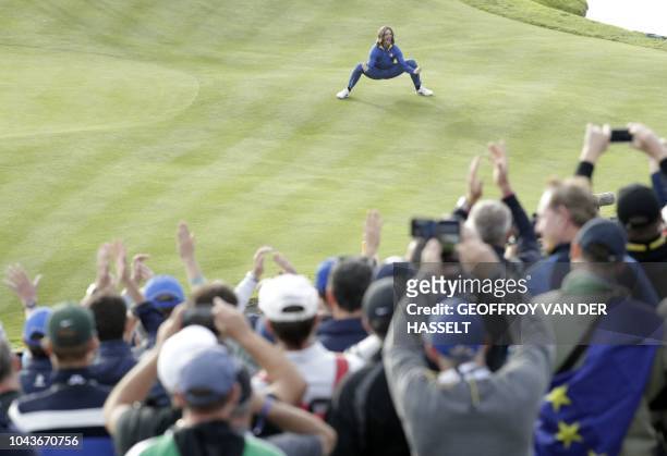 Europe's English golfer Tommy Fleetwood celebrates after Europe won the 42nd Ryder Cup at Le Golf National Course at Saint-Quentin-en-Yvelines,...