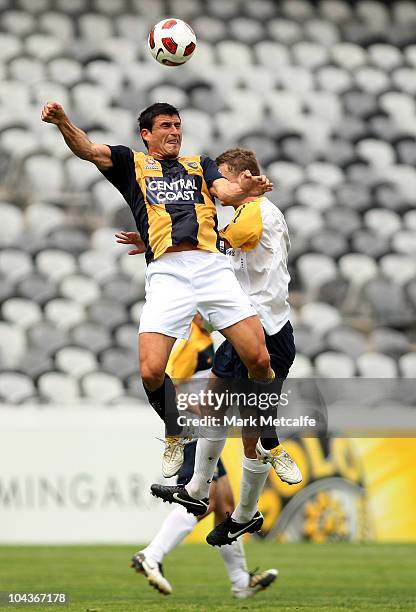 Sam Gallagher of the Young Socceroos and Nik Mrdja of the Mariners compete for the ball during the friendly match between the Young Socceroos and the...