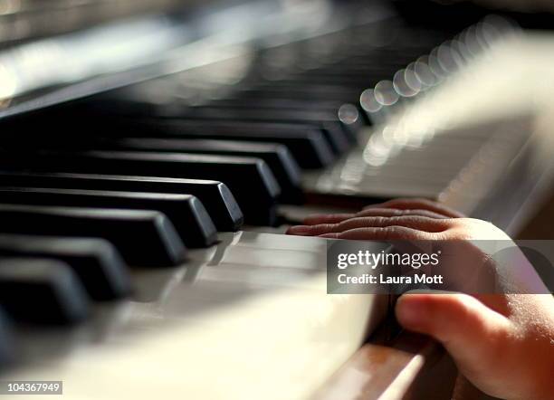 toddler playing piano - worcester england stock pictures, royalty-free photos & images