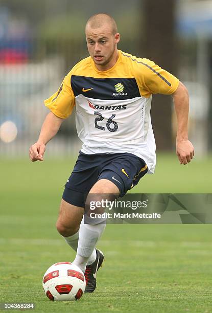 Marc Warren of the Young Socceroos runs with the ball during the friendly match between the Young Socceroos and the Central Coast Mariners at...