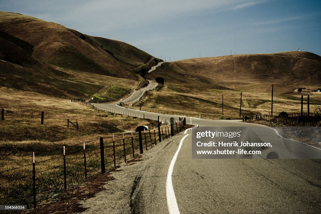 Winding and steep road towards a pass