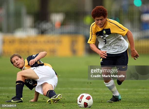 Mustafa Amini of the Young Socceroos runs with the ball during the friendly match between the Young Socceroos and the Central Coast Mariners at...
