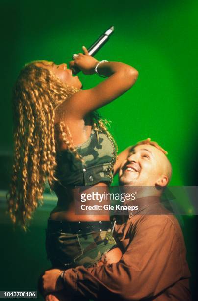 Lil' Kim with a fan on stage, Ancienne Belgique , Brussels, Belgium, 28th June 2001.