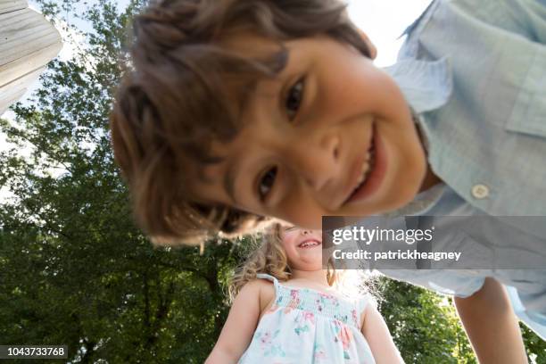 little boy and girl - boy curly blonde stock pictures, royalty-free photos & images