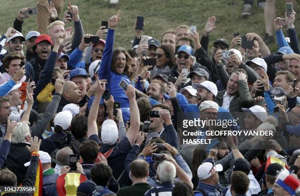 English golfer Tommy Fleetwood celebrates after Europe won the 42nd Ryder Cup at Le Golf National Course at Saint-Quentin-en-Yvelines, south-west of...