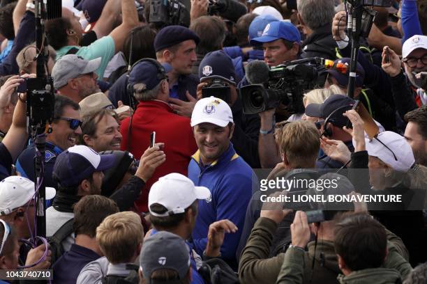 Europe's Spanish golfer Jon Rahm reacts after Europe won the 42nd Ryder Cup at Le Golf National Course at Saint-Quentin-en-Yvelines, south-west of...