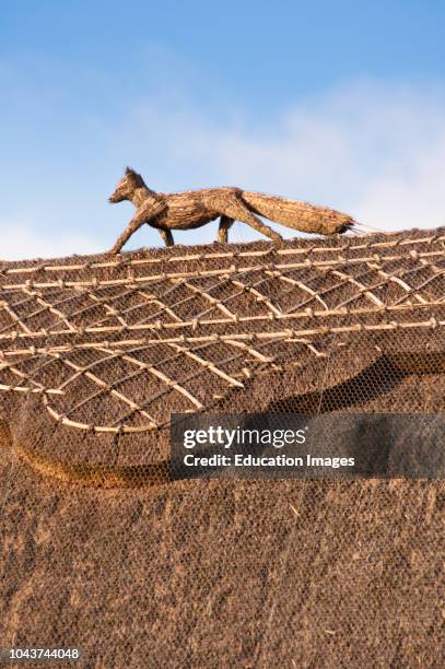 Close up detailing of a thatched roof belonging to a barn conversion in the village of Stanton in the Gloucestershire Cotswolds.