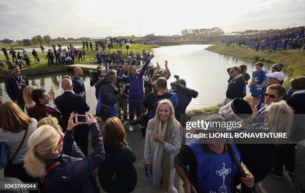 Europe's English golfer Tommy Fleetwood celebrates after Europe won the 42nd Ryder Cup at Le Golf National Course at Saint-Quentin-en-Yvelines,...