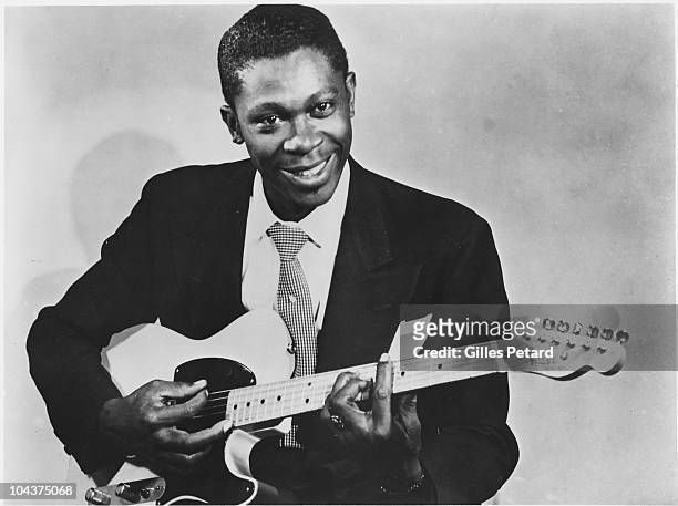 King poses for a studio portrait in 1955 in the United States. He holds a Fender Esquire guitar.