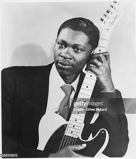 King poses for a studio portrait in 1955 in the United States. He holds a Fender Esquire guitar.