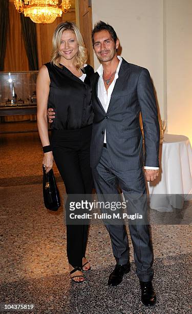 Natasha Stefanenko and her husband Luca Sabbioni attend Salvador Dali Opening Exhibition during Milan Fashion Week Womenswear S/S 2011 on September...