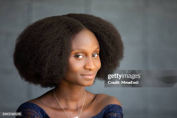 portrait of a beautiful african woman - natural hair stock pictures, royalty-free photos & images
