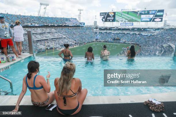 Fans watch the game between the Jacksonville Jaguars and the New York Jets from the pool at TIAA Bank Field on September 30, 2018 in Jacksonville,...