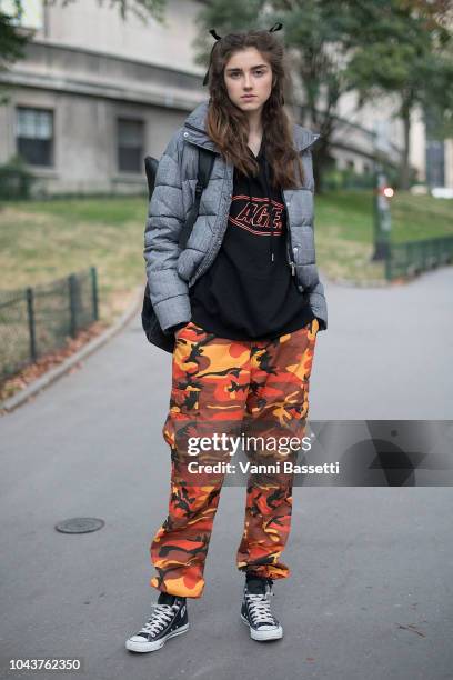 Model poses wearing camo pants and Converse shoes after the John Galliano show at the Cite de l'Architecture et du Patrimoine during Paris Fashion...