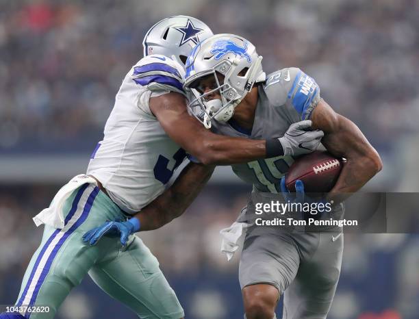 Byron Jones of the Dallas Cowboys hits Kenny Golladay of the Detroit Lions in the fourth quarter of a game at AT&T Stadium on September 30, 2018 in...