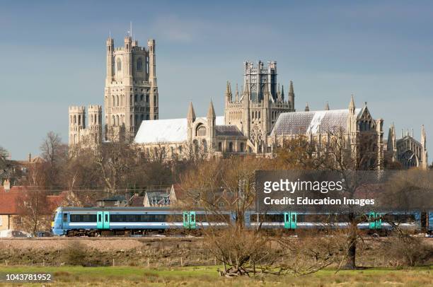 Shot from across the Fens of Ely Cathedral with train passing Ely, Cambridgeshire, England.