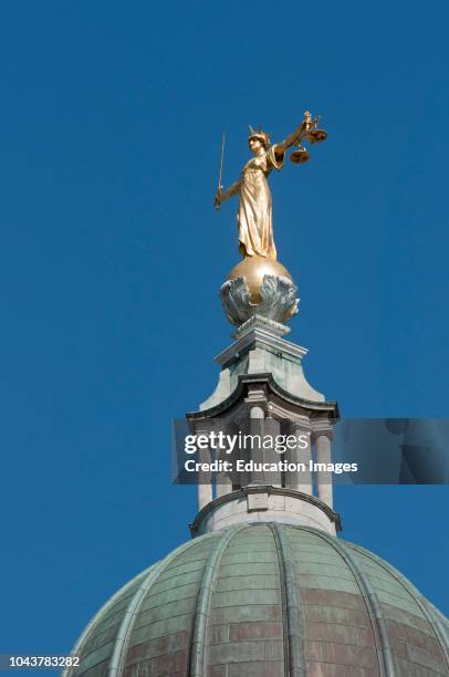 Lady Justice statue atop the Old Bailey central criminal court in the City of London UK.