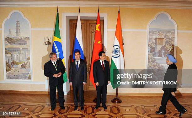 Presidents Luiz Inacio Lula da Silva of Brazil, Dmitry Medvedev of Russia, Hu Jintao of China, and Indian Prime Minister Manmohan Singh meet for a...