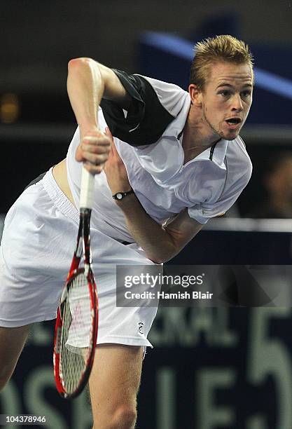 Kristof Vliegen of Belgium serves during his match against Jarkko Nieminen of Finland during day four of the Open de Moselle at Les Arenes on...