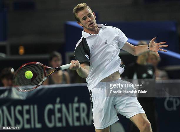 Kristof Vliegen of Belgium plays a forehand during his match against Jarkko Nieminen of Finland during day four of the Open de Moselle at Les Arenes...