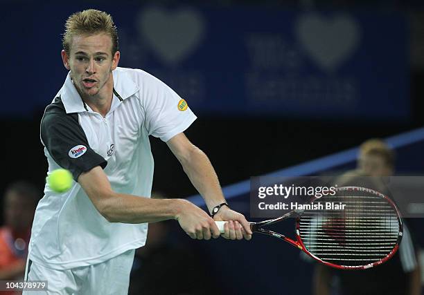 Kristof Vliegen of Belgium plays a backhand during his match against Jarkko Nieminen of Finland during day four of the Open de Moselle at Les Arenes...