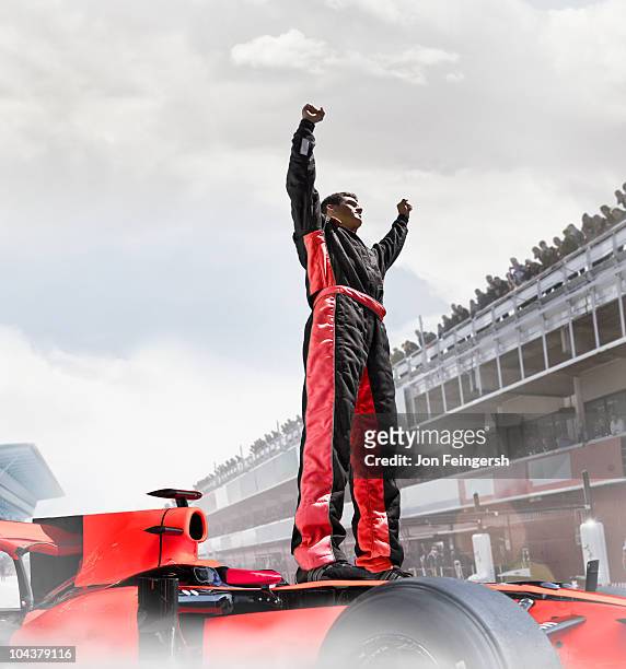 winning the race - white jump suit stock pictures, royalty-free photos & images