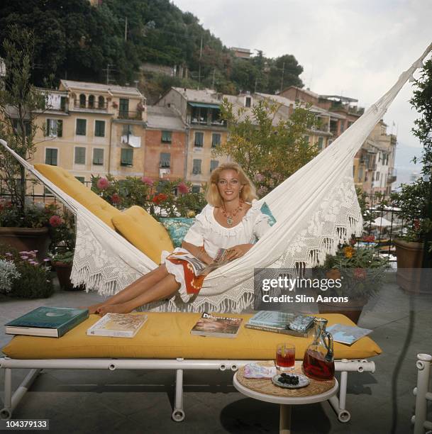 Daniela Cameli, formerly actress Daniela Bianchi, lounges on the terrace of her apartment in Portofino, Italy, August 1977.