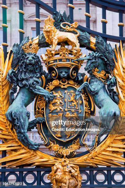 Royal coat of arms on the front gate of Buckingham palace, London, England.