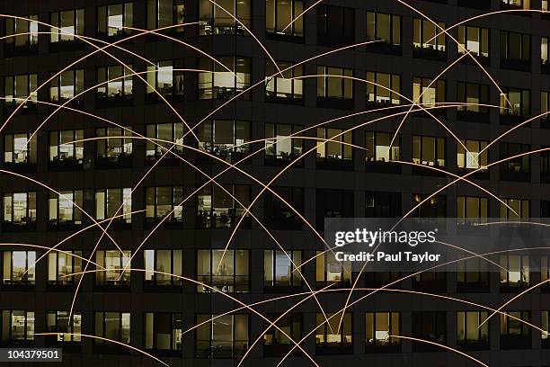 light trails and offices - capitalismo fotografías e imágenes de stock