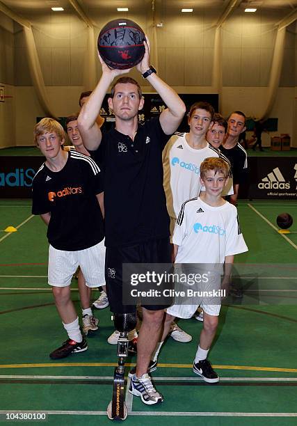 Team GB paralympian John McFall lines up a shot in front of pupils from St Margarets High during the launch of adiStars, a new initiative from adidas...