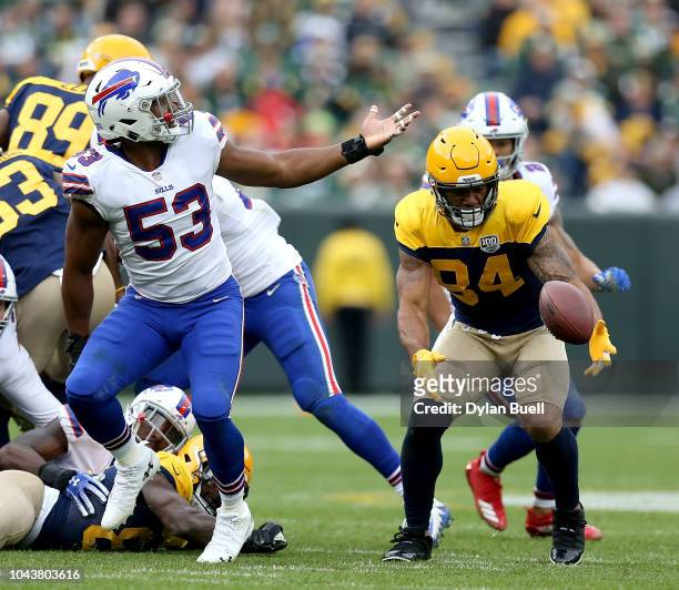 Lance Kendricks of the Green Bay Packers recovers a fumble during the fourth quarter of a game against the Buffalo Bills at Lambeau Field on...