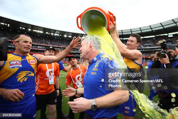 Jeremy McGovern of the Eagles pours Gatorade on Adam Simpson, Senior Coach of the Eagles after winning the 2018 Toyota AFL Grand Final match between...
