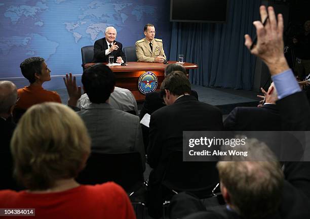 Secretary of Defense Robert Gates and Chairman of the Joint Chiefs of Staff Adm. Mike Mullen answer questions from the media during a press briefing...