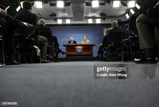 Secretary of Defense Robert Gates and Chairman of the Joint Chiefs of Staff Adm. Mike Mullen answer questions from the media during a press briefing...