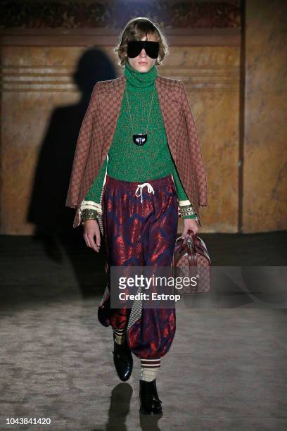 Model walks the runway at the Gucci show during Paris Fashion Week Spring/Summer 2019 on September 24, 2018 in Paris, France.