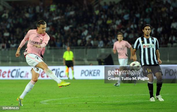 Josip Ilicic of Palermo scores a goal as Alberto Aquilani of Juventus looks on during the Serie A match between Juventus and Palermo at Olimpico...
