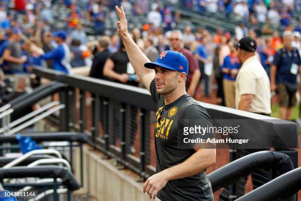 David Wright of the New York Mets gestures to fans as he walks into the dugout after defeating the Miami Marlins at Citi Field on September 30, 2018...