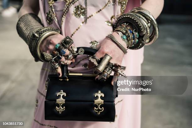 Guest is seen on the street during Paris Fashion Week SS19 wearing Vivienne Westwood on September 29, 2018 in Paris, France.