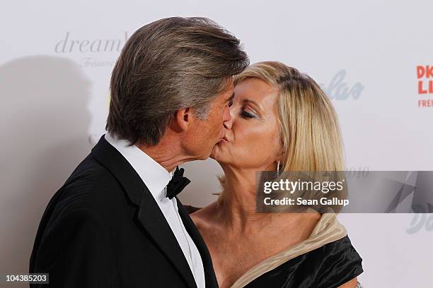 Olivia Newton-John and her husband John Easterling attend the Dreamball 2010 charity gala at the Grand Hyatt hotel on September 23, 2010 in Berlin,...