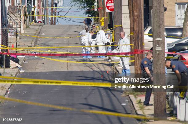 Police join members of the ATF and the FBI as they investigate North Hall Street in Allentown, Pa. Around 10 a.m. Sunday, Sept. 30, 2018 after a...